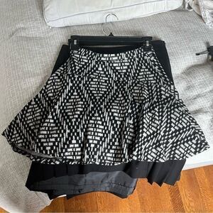 Aqua(Bloomingdales) black and white patterned circle skirt.